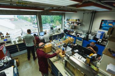 Five scientists working in a lab